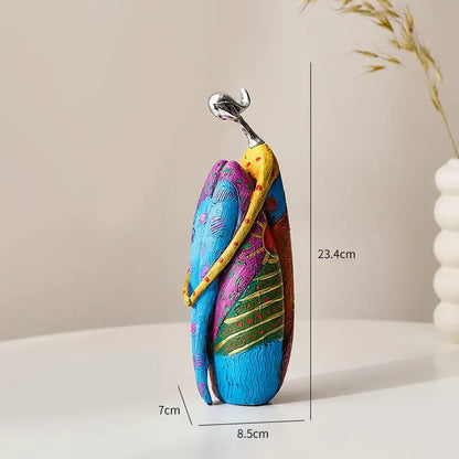 Vibrant decorbites abstract woman sculpture featuring colorful, stylized embracing figures for living room decor