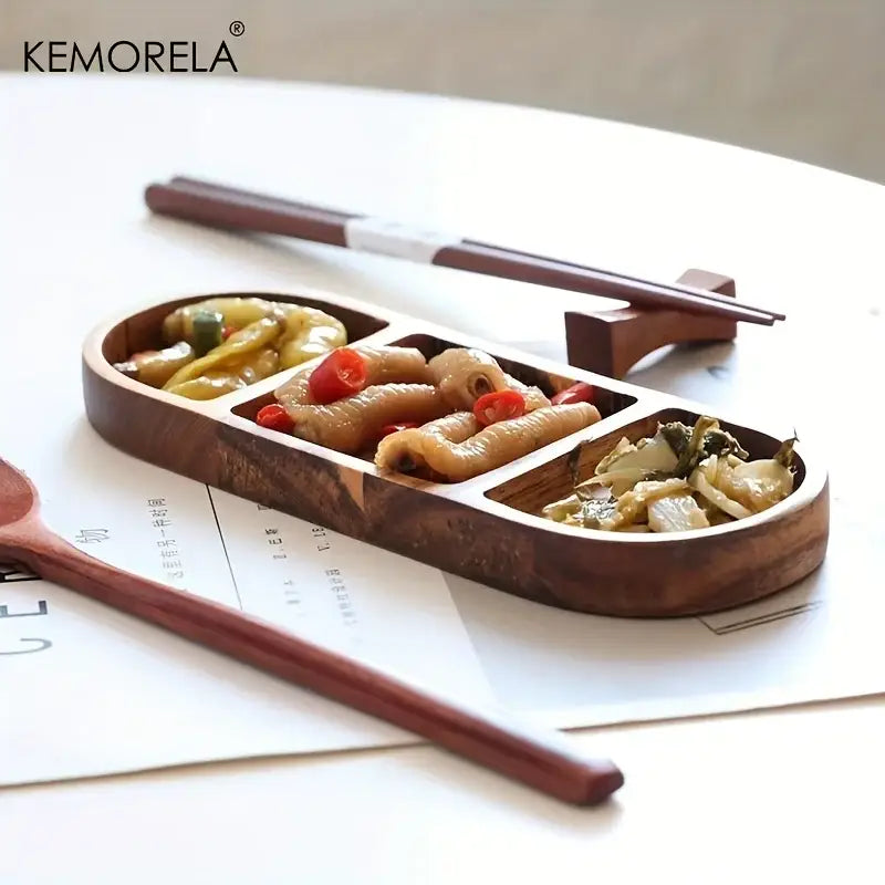 Dark brown acacia wood oval dip plate with three compartments holding assorted pickled vegetables for serving