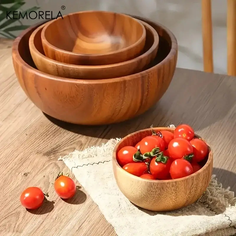 Set of three nested DecorBites acacia wooden salad bowls with warm finish and visible grain for serving fruit and vegetables