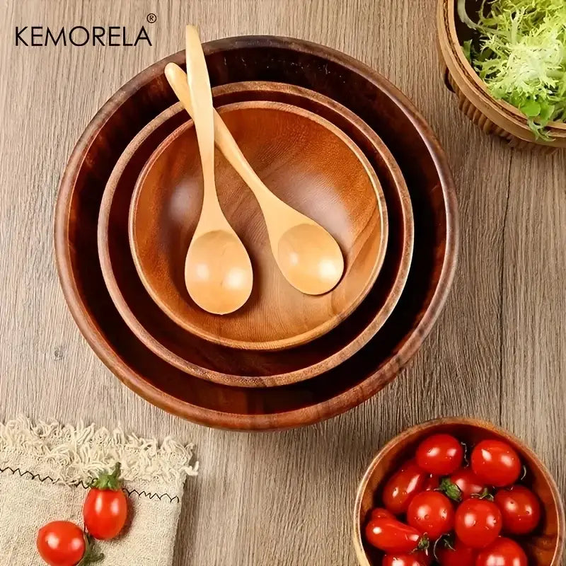 Set of three nested acacia wooden salad bowls with matching spoons featuring a warm natural wood finish and smooth edges