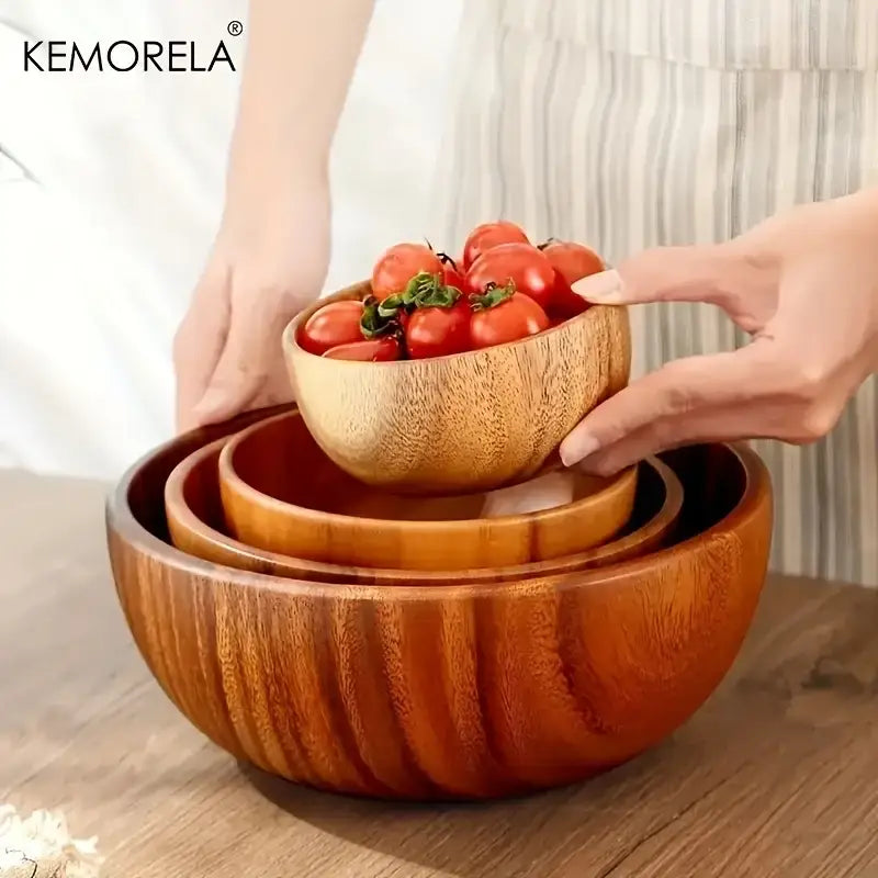 Set of three nested decorbites acacia wooden salad bowls with warm finish and visible grain patterns for versatile use