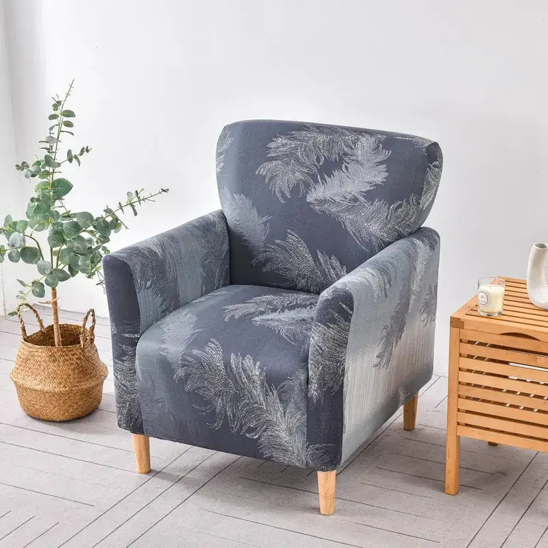 Gray accent chair with white feather pattern covered in stretchy fabric DecorBites accent chair cover slipcover