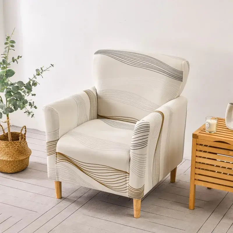 Cream-colored DecorBites accent chair cover with elegant gold and gray wavy line patterns for chair cover slipcovers
