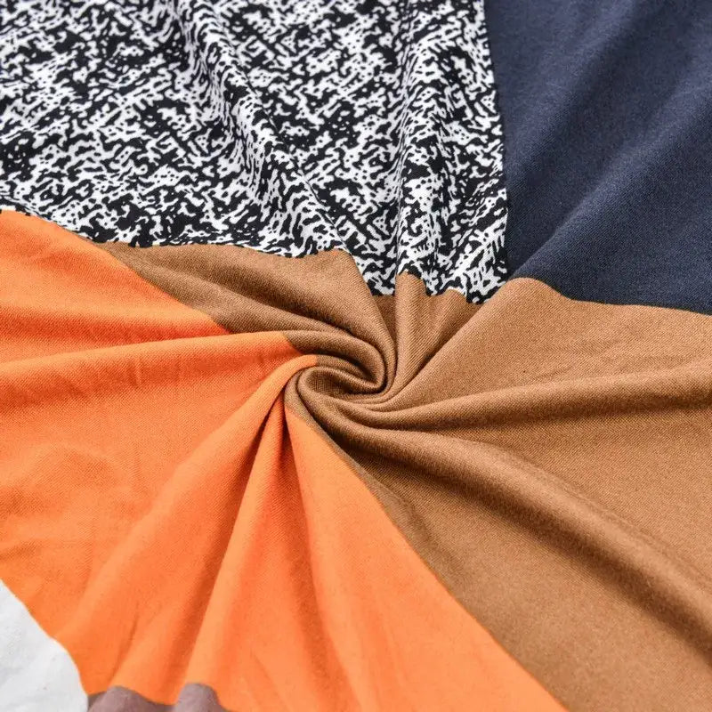 DecorBites accent chair cover slipcovers with swirled orange brown navy blue and black and white abstract fabric design