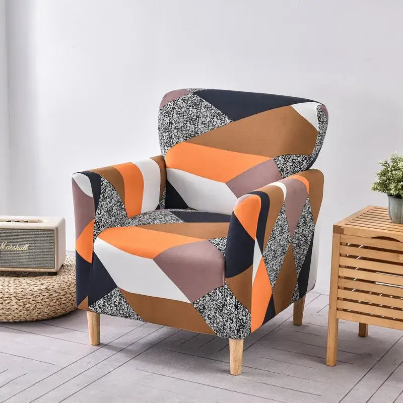 DecorBites™ accent chair cover slipcovers featuring a vibrant orange white black and speckled gray geometric pattern