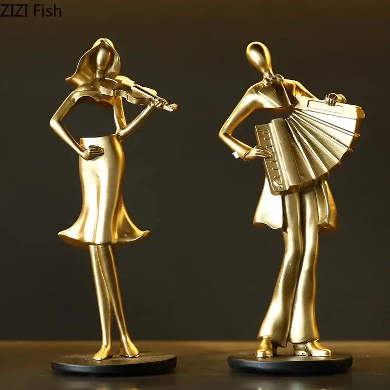Golden accordion musician resin sculpture and violinist figurine on black bases for aesthetic room decor by decorbites