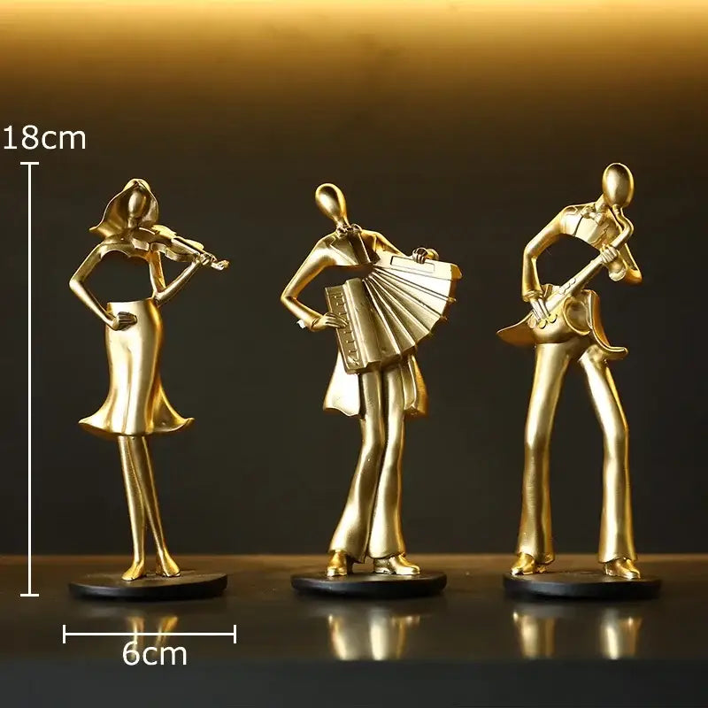 Set of three golden metallic musician resin sculptures featuring accordion musician violinist and guitarist for decor