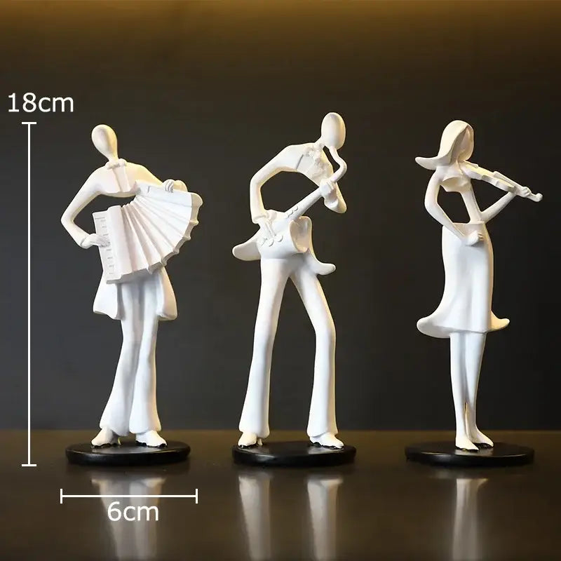 Set of three white resin musician sculptures featuring an accordion musician for DecorBites aesthetic room decor