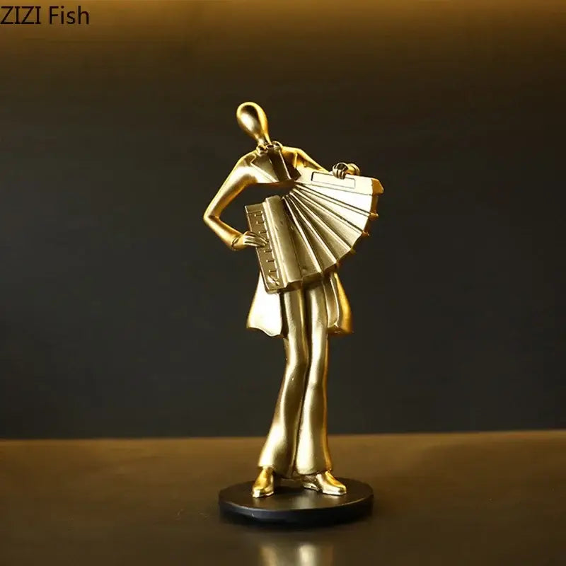 Golden metallic accordion musician resin sculpture on black base by decorbites for aesthetic room decor