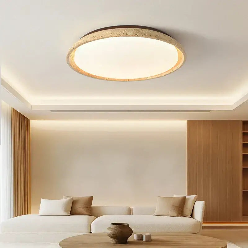 Circular acryl travertine led ceiling light with textured earthy-toned frame and warm white illuminated center