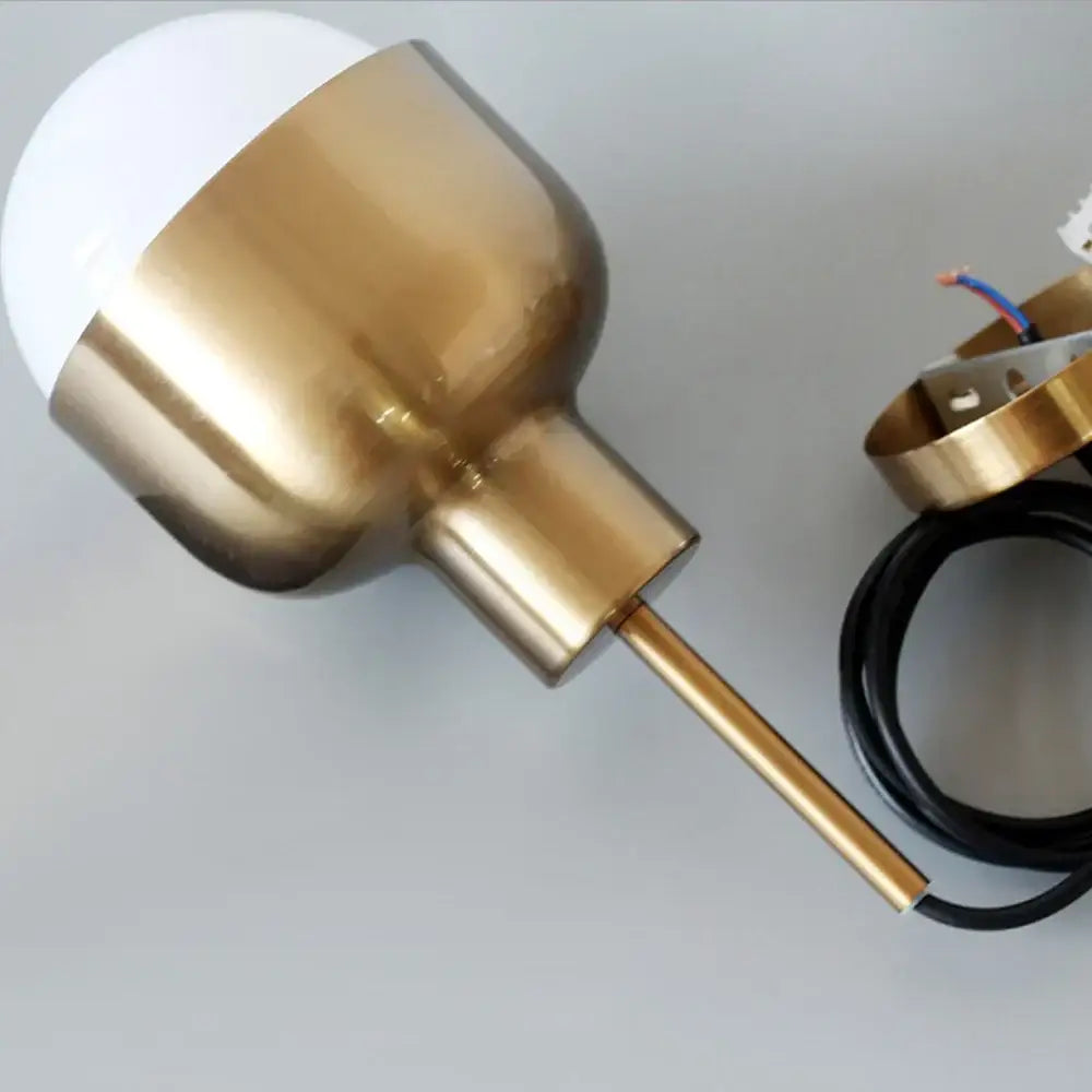 DecorBites™ acrylic ball pendant light with brass finish, white bulb, and exposed wiring for modern ceiling decor