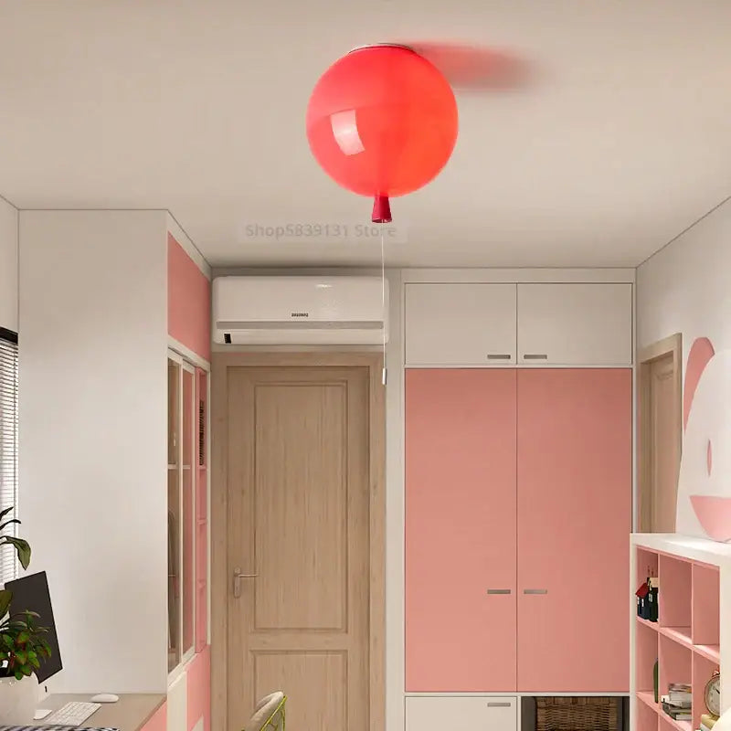 A vibrant red acrylic balloon ceiling light fixture from decorbites™ for modern nordic living room and bedroom decor