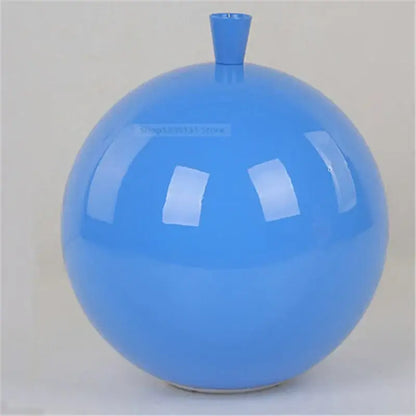 A glossy blue ceramic vase placed under decorbites™ acrylic balloon ceiling lights for modern nordic living room decor
