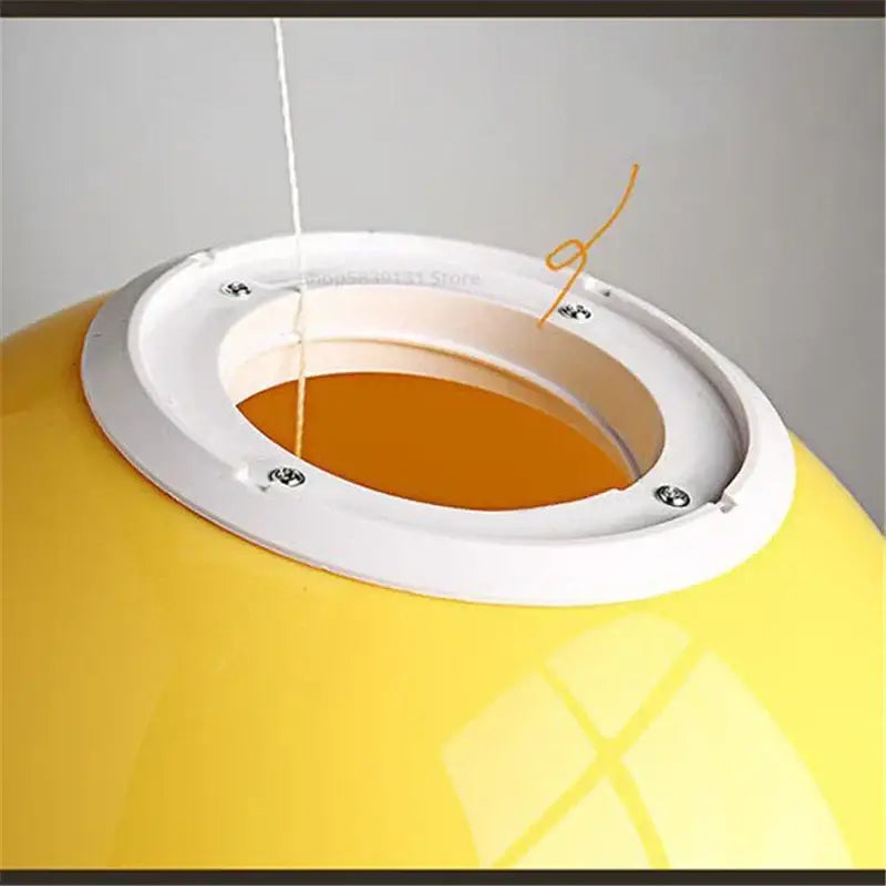 Bright yellow acrylic balloon ceiling light with white ring and orange interior for modern Nordic living room lighting