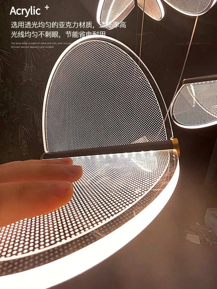 Modern acrylic blade stair chandelier with sleek perforated design and warm led illumination for cafes and villas