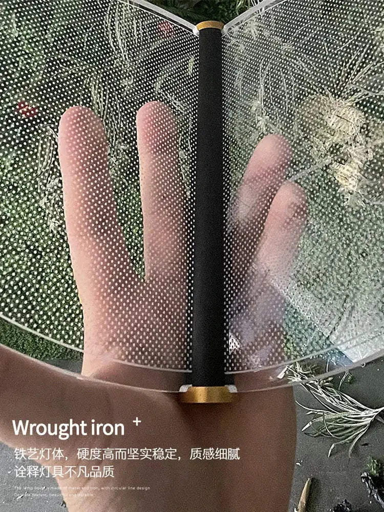 Transparent perforated mesh fan with black handle and gold end caps for DecorBites acrylic blade stair chandelier