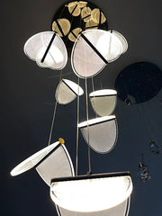 Modern metallic acrylic blade stair chandelier with illuminated semi-circular shades and black rods for cafe and villa ambiance