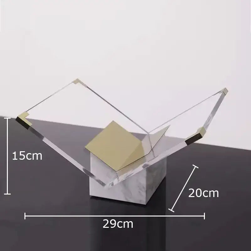 Modern geometric acrylic bookshelf with gold-toned metallic accents and marble base for elegant home decor organization