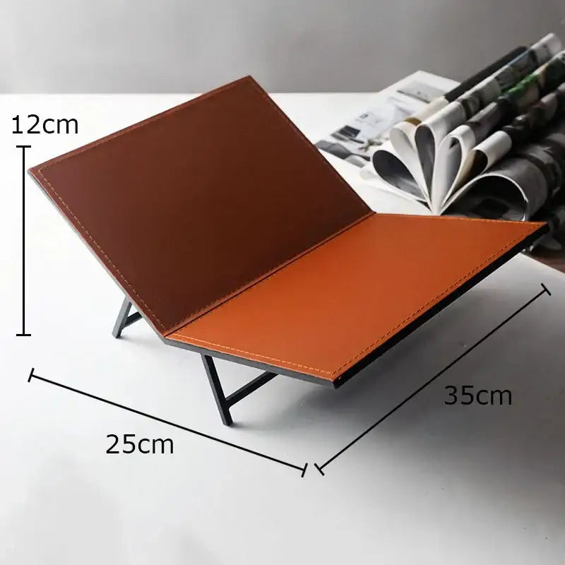 Brown and orange leather desk organizer with minimalist metal frame for home decor beside DecorBites acrylic bookshelf marble base