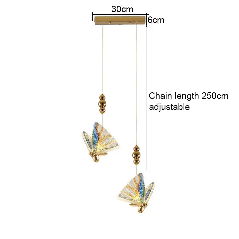 Gold-toned acrylic butterfly chandelier ceiling lamp with iridescent blue and white wings for indoor lighting