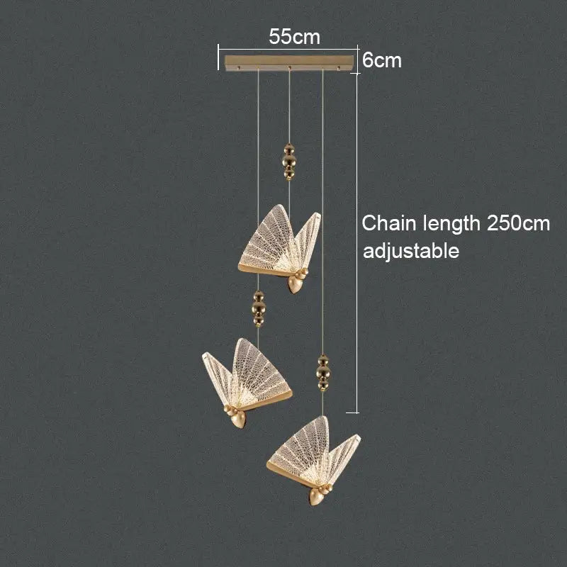 Gold-toned acrylic butterfly chandelier ceiling lamp with intricate lace-like detailing and adjustable chain for indoor lighting