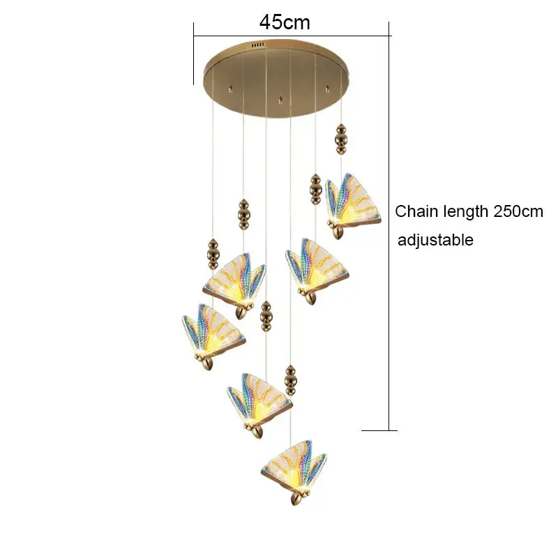 DecorBites acrylic butterfly chandelier ceiling lamp with five illuminated iridescent blue and yellow butterfly lights suspended from a brass fixture