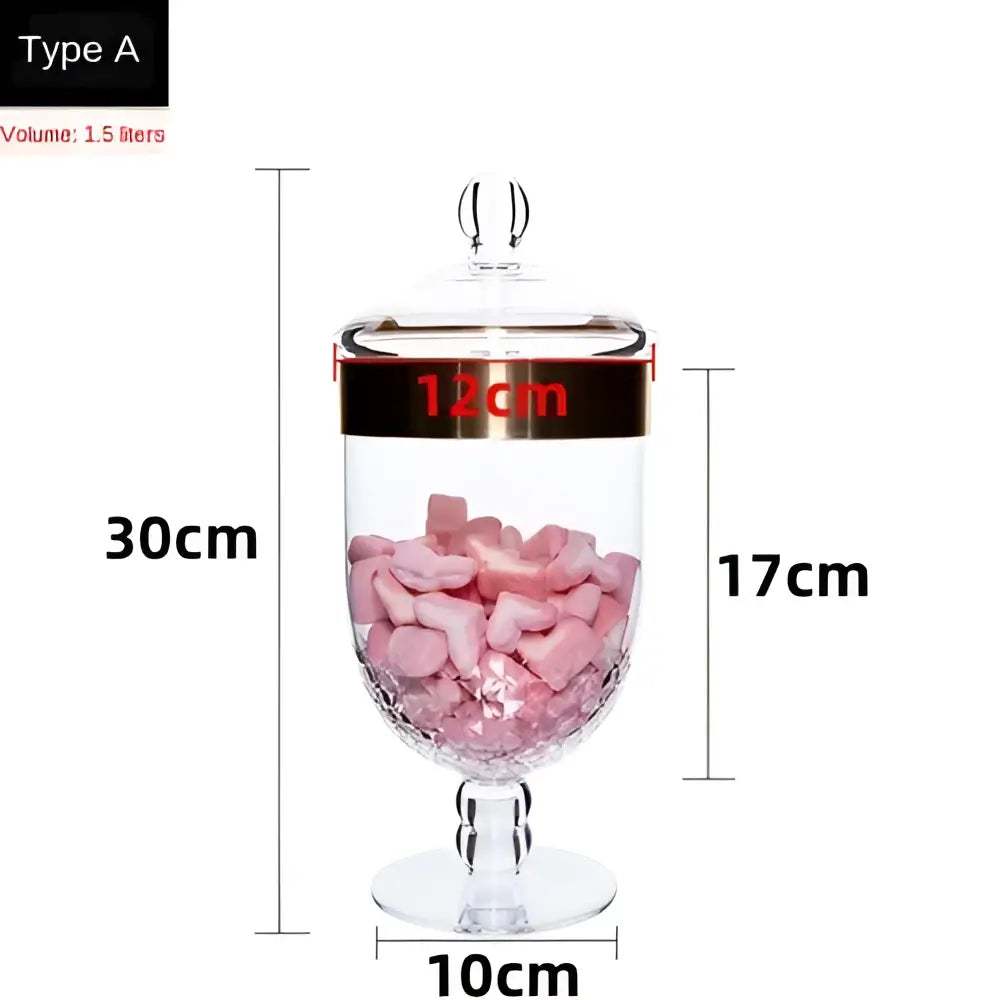 Clear glass acrylic candy jar with gold rimmed lid and stem filled with pink marshmallows from decorbites spice jar set