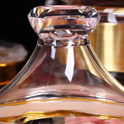 Clear glass decanter with faceted diamond stopper and gold-toned rim in DecorBites acrylic candy and spice jar set