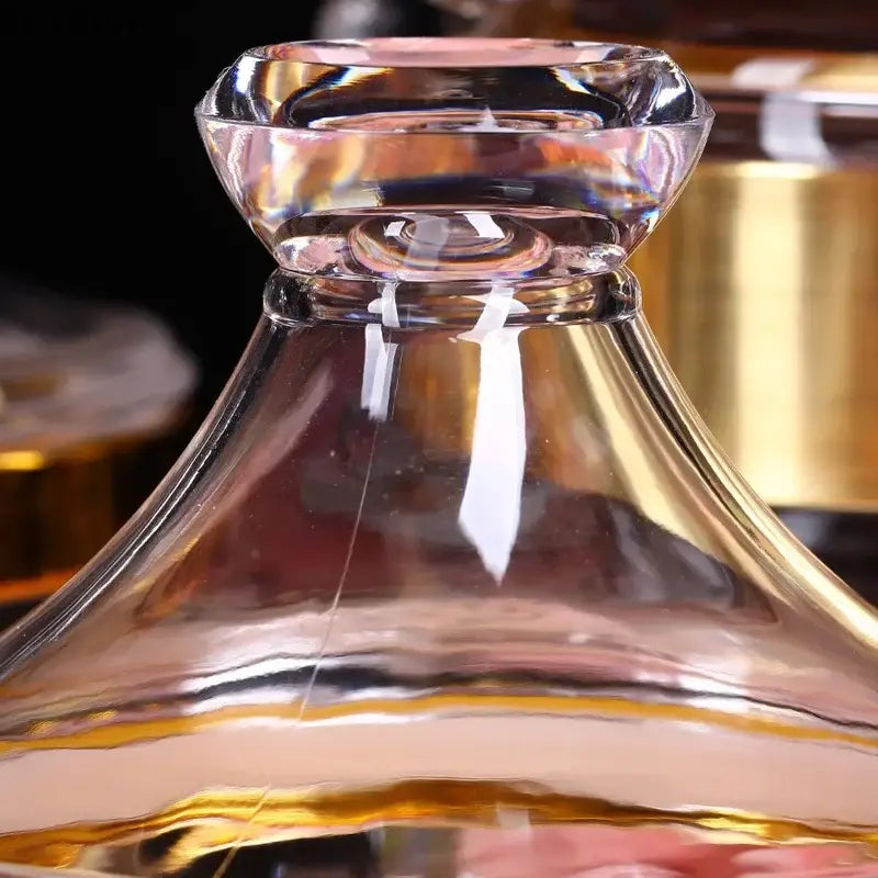 Clear glass decanter with faceted diamond stopper and gold-toned rim in DecorBites acrylic candy and spice jar set