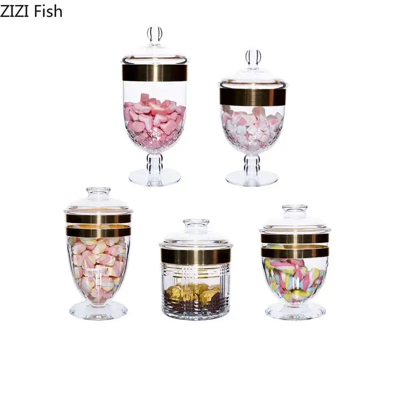 DecorBites™ clear acrylic candy and spice jar set with gold lids shaped jars filled with colorful marshmallows and chocolate