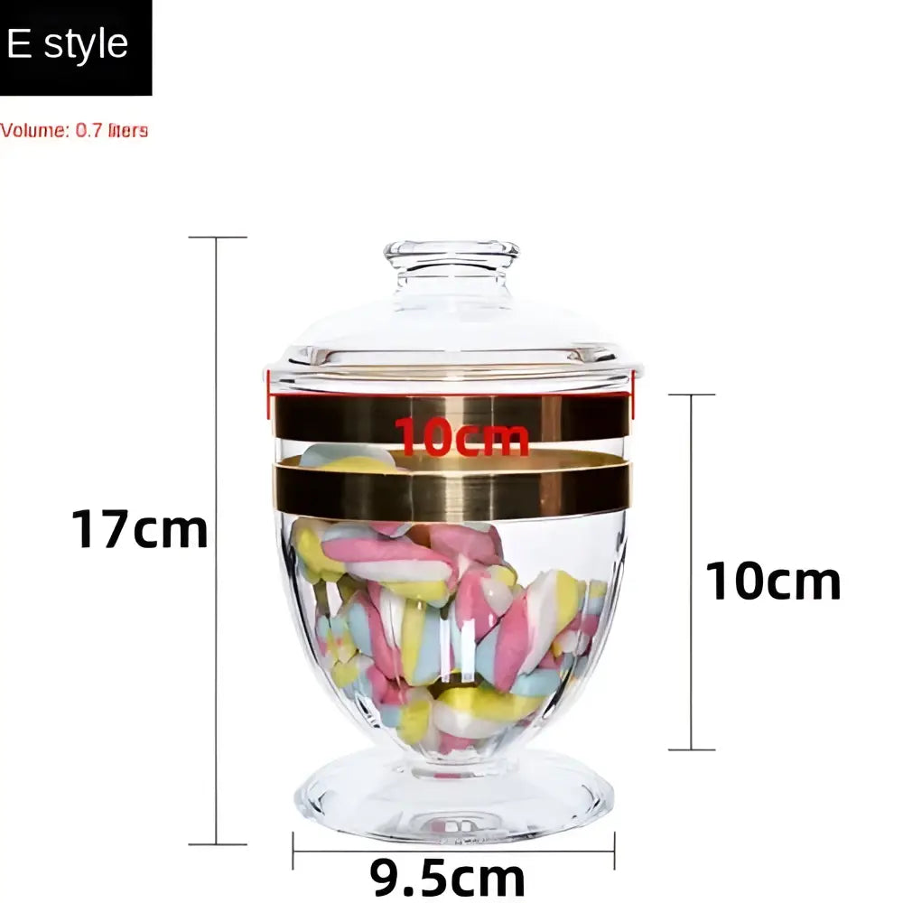 Clear glass acrylic candy jar with gold-toned bands and lid filled with colorful marshmallows from DecorBites™ spice jar set