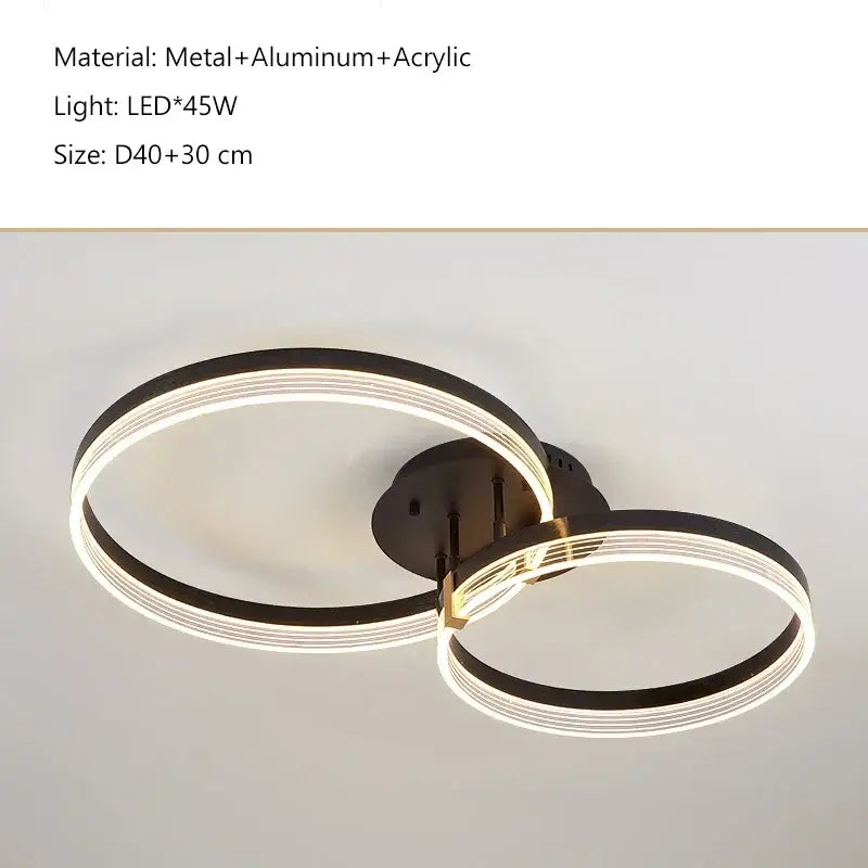 Modern black acrylic ceiling chandelier with two interlocking LED rings and brushed metal base for living room decor