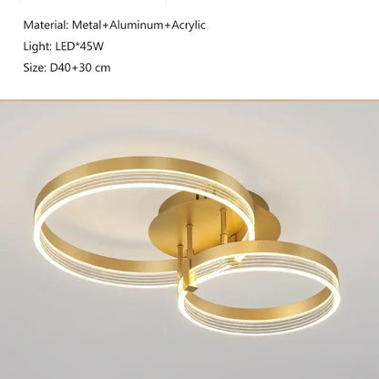 Modern gold-toned acrylic ceiling chandelier with two interlocking metal and acrylic rings for living room lighting