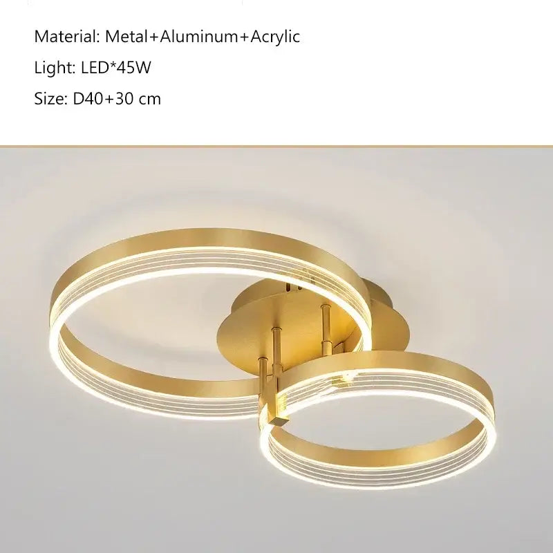 Modern gold-toned acrylic ceiling chandelier with two interlocking metal and acrylic rings for living room lighting