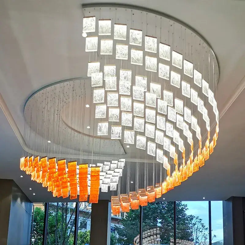 Decorbites acrylic chandelier lights with curved design and cascading clear and orange acrylic glass panels for modern home lighting