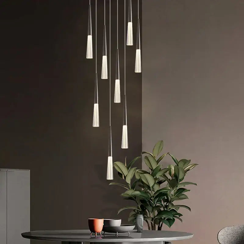 Modern minimalist acrylic cone pendant light with frosted glass shades and slender metallic rods for villa stair or kitchen