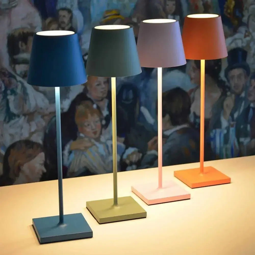 Four decorbites™ acrylic crystal art led table lamps with slender metallic stems and colorful conical shades in blue green lavender and orange