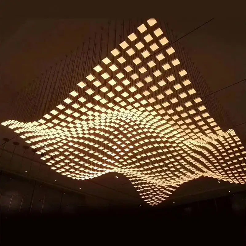 DecorBites acrylic crystal hanging pendant light with geometric square panels emitting warm golden glow for living room