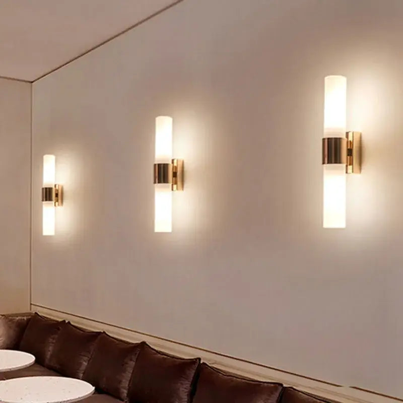 Modern gold-toned decorbites acrylic cylinder wall lamp with frosted glass shades for bedroom and living room lighting