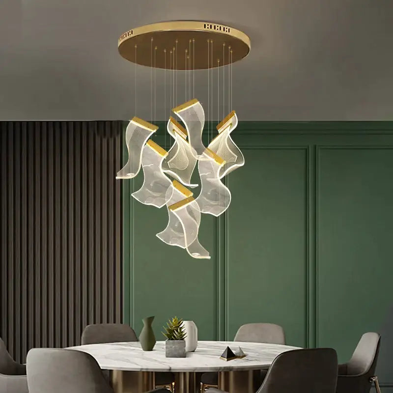Modern gold-accented decorbites™ acrylic deluxe staircase chandelier with translucent flowing glass elements for villa and lobby