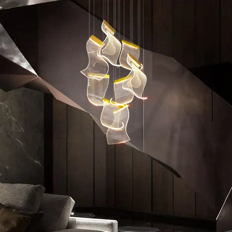Modern decorbites™ acrylic deluxe staircase chandelier with translucent glass shades and warm yellow lighting for living room decor