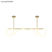 Gold-toned DecorBites acrylic flex tube suspension light with sleek LED rods providing natural ceiling light