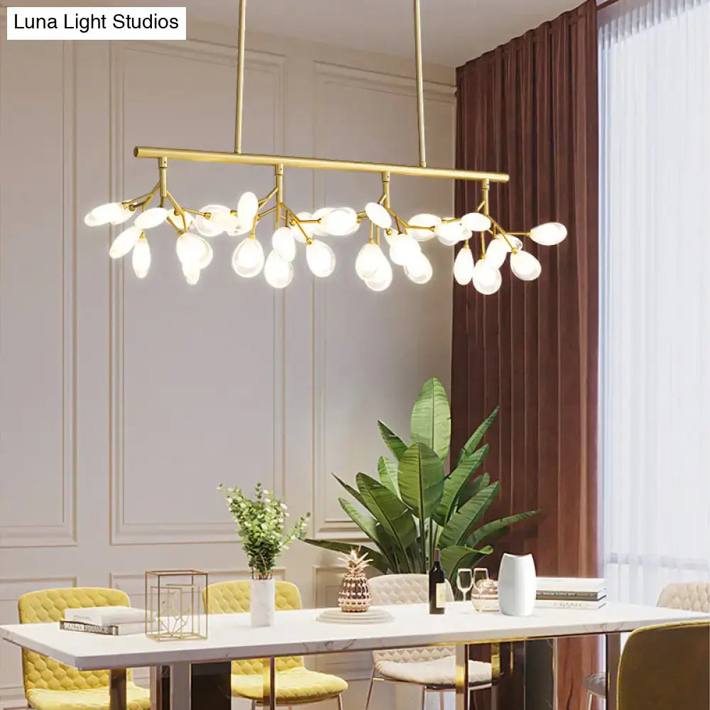 Gold-toned decorbites acrylic island lighting fixture with frosted glass globes and branching design ideal for dining rooms