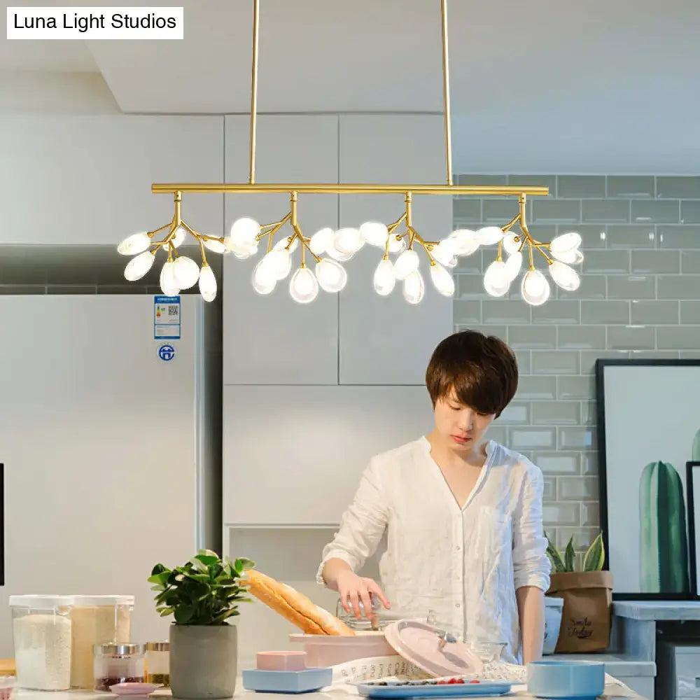 Gold-toned decorbites acrylic island lighting fixture with branching arms and frosted glass globes for dining rooms