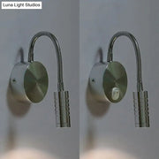 Modern chrome gooseneck cylinder wall mount reading lamp with a sleek silver-toned finish and textured cylindrical base