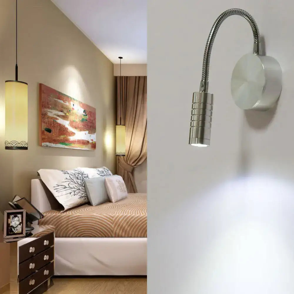 Silver chrome gooseneck cylinder wall mount reading lamp with flexible neck and circular base for bedroom use