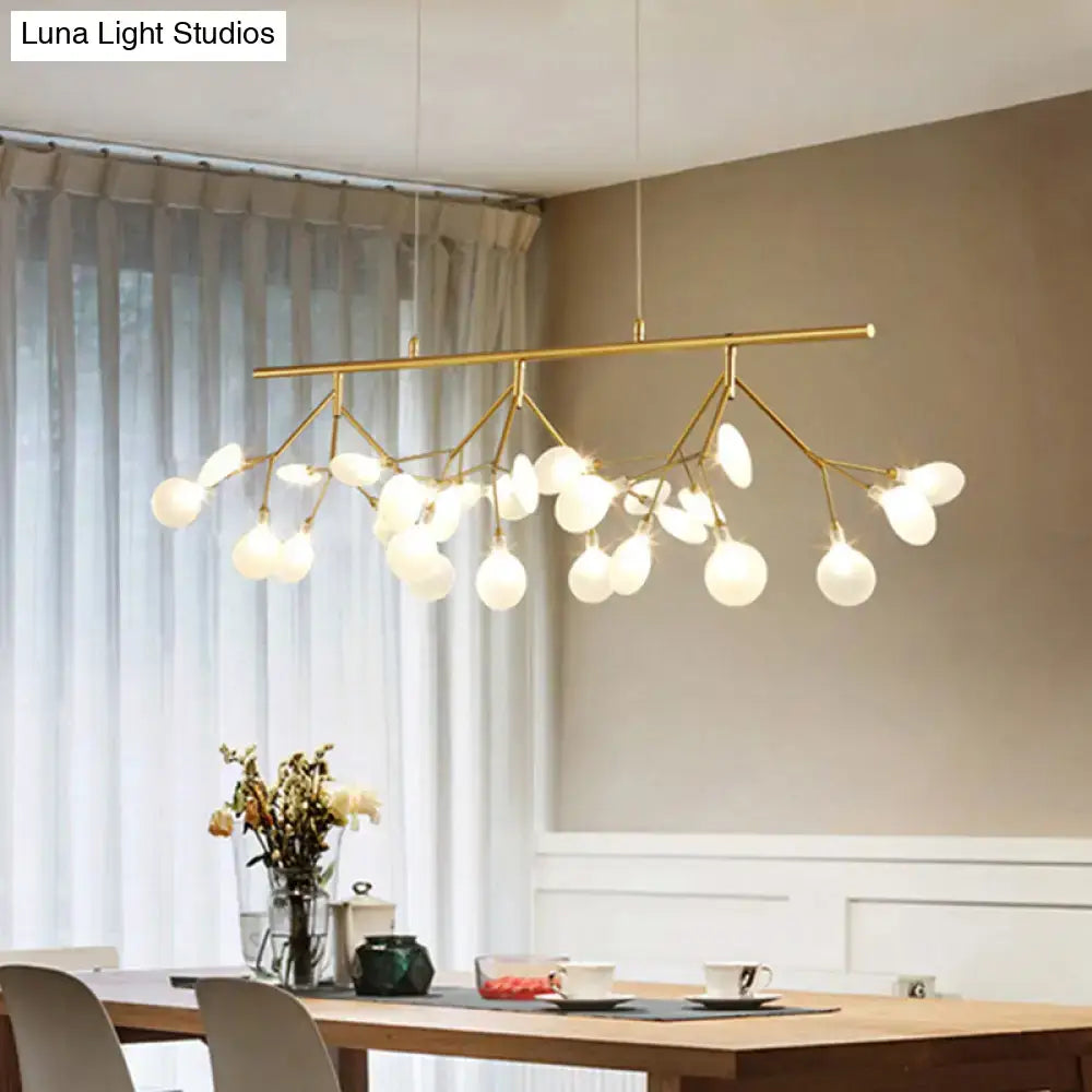 Gold-toned firefly metal pendant with multiple frosted glass globes and adjustable hanging cord for bedroom lighting