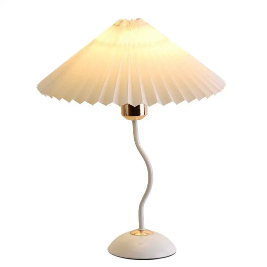 Decorbites adjustable pleated table lamp with cream fabric shade gold metal base and curved white stem for bedroom use