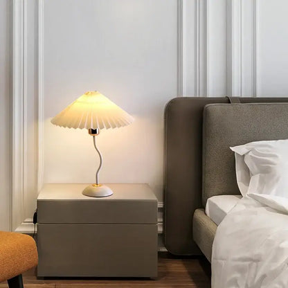 Decorbites adjustable pleated table lamp cream with gold base on minimalist nightstand for bedroom light