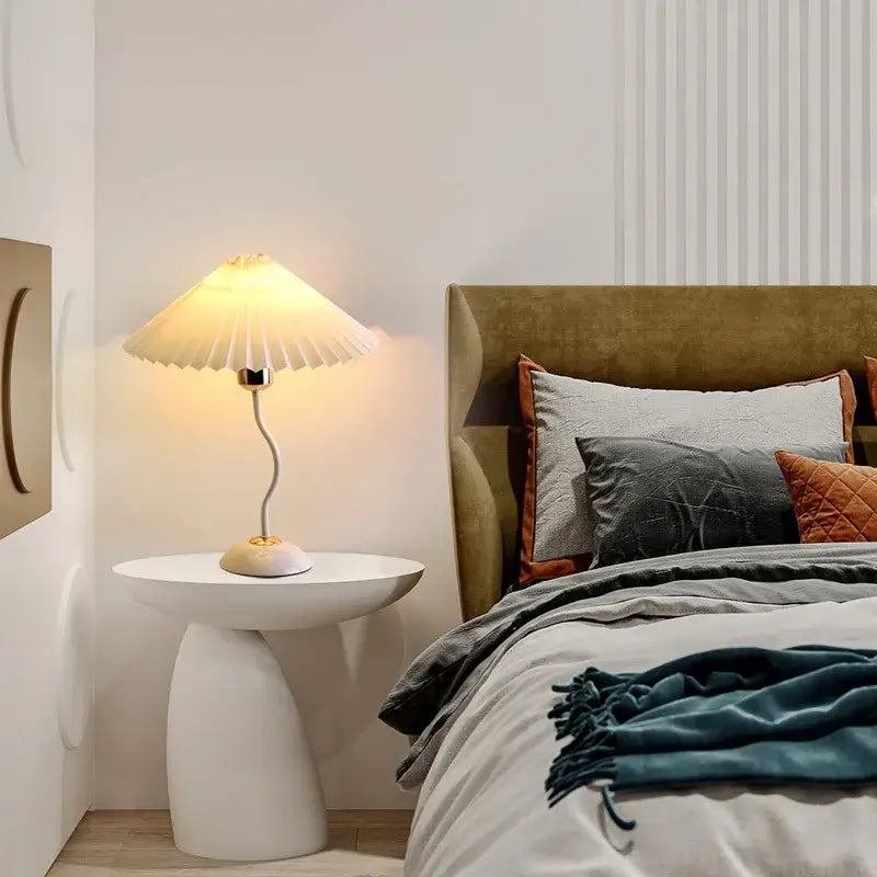 Decorbites adjustable pleated table lamp in cream ceramic with gold curved stem for bedroom or desk lighting